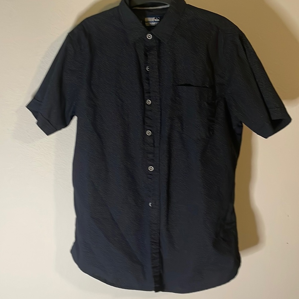 This is a mens large Monument button up, this shirt fits around the arms nicely.